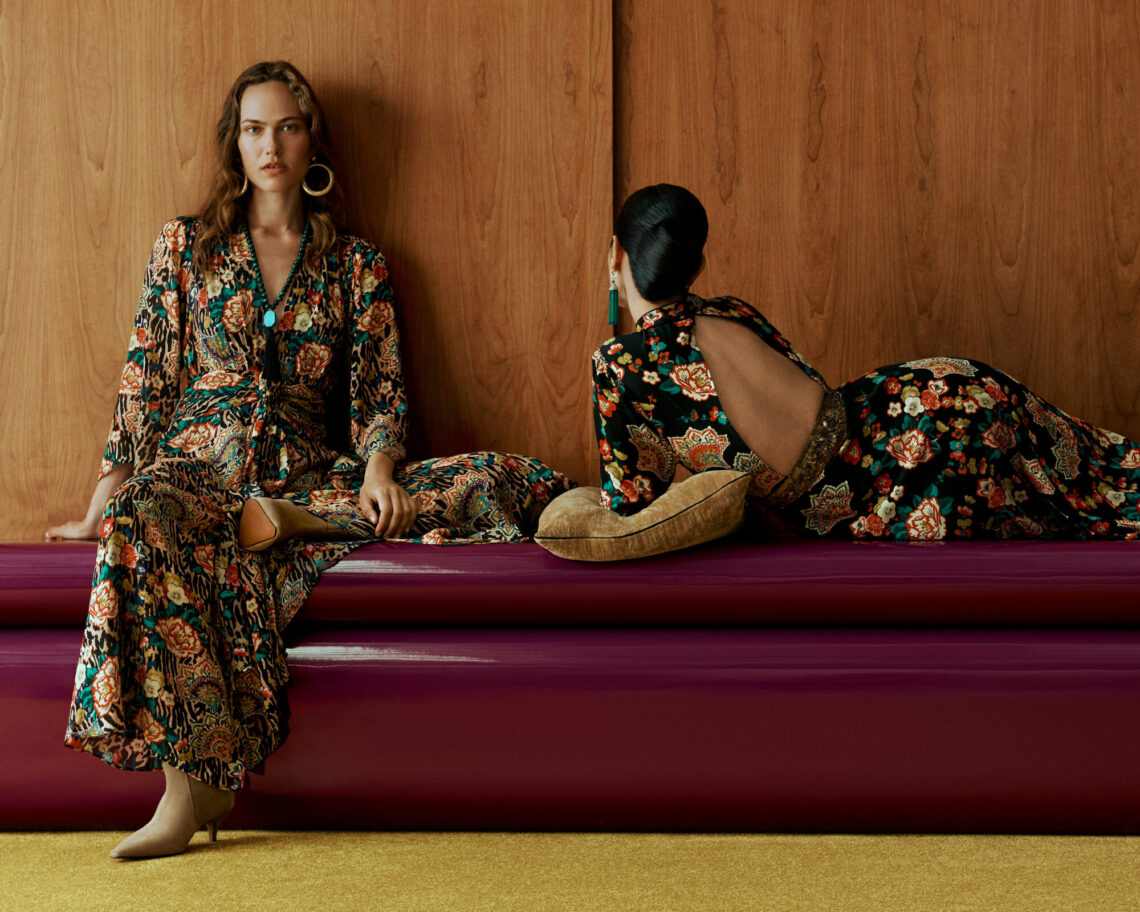 Two models in floral print maxi dresses from the John Lewis x RIXO collection
