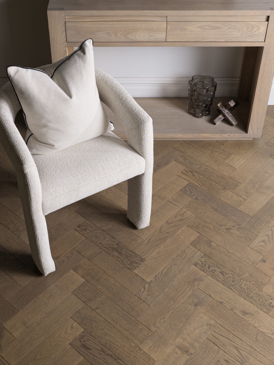Harlech Amaretti Oak herringbone flooring in cool silver-grey tones
